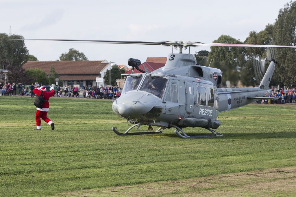 Santa Claus arrives at RAF Akrotiri by 84 Sqn Helcopter and is greeted by children from RAF Akrotiri Primary School. 12 December 2016 RAF Akrotiri - Cyprus