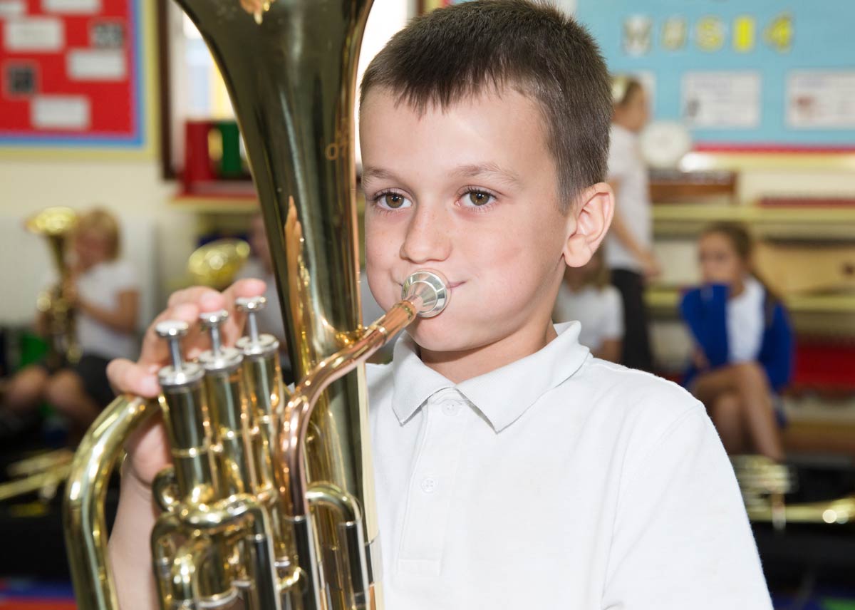 Boy playing instrument